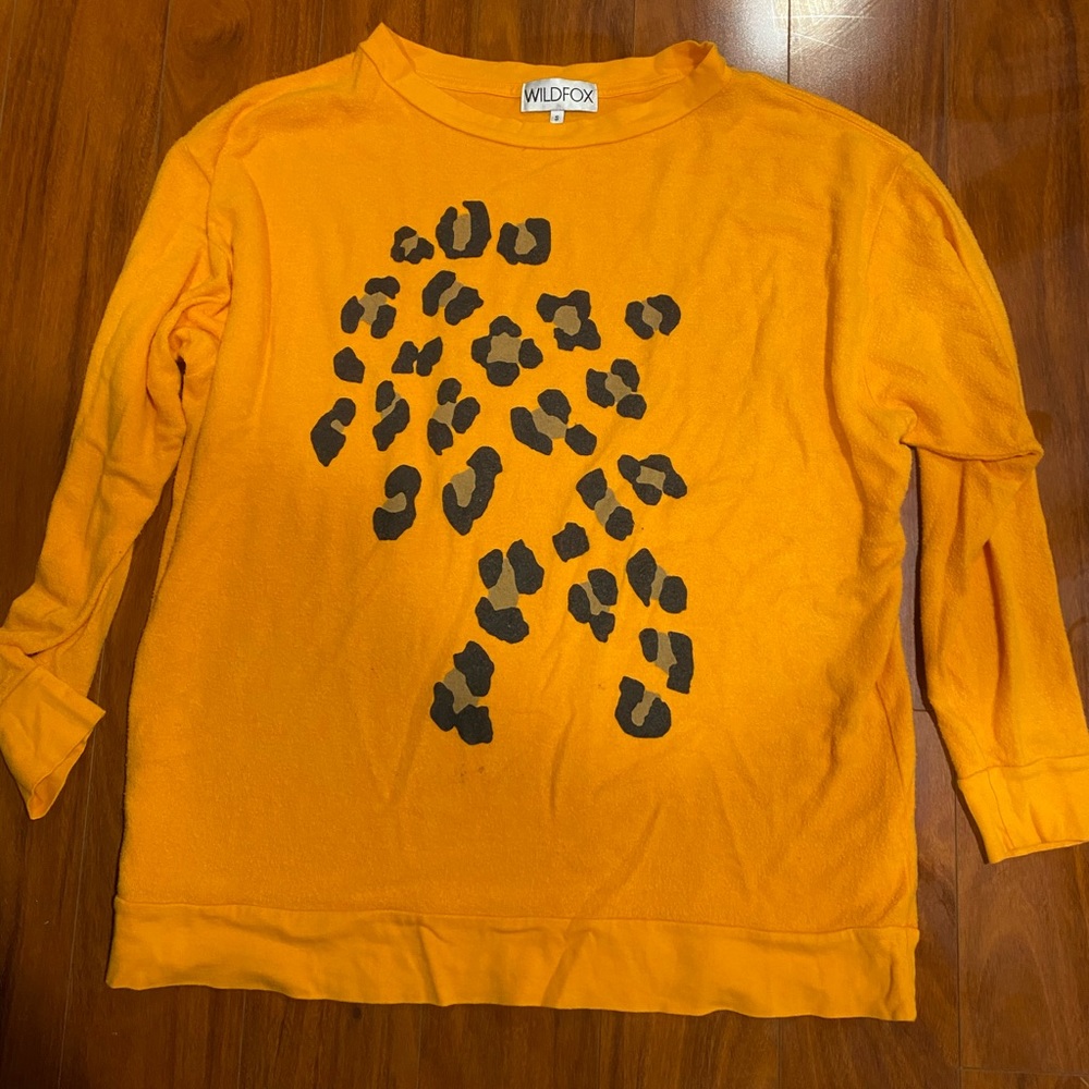 Wildfox orange cheetah print sweatshirt.